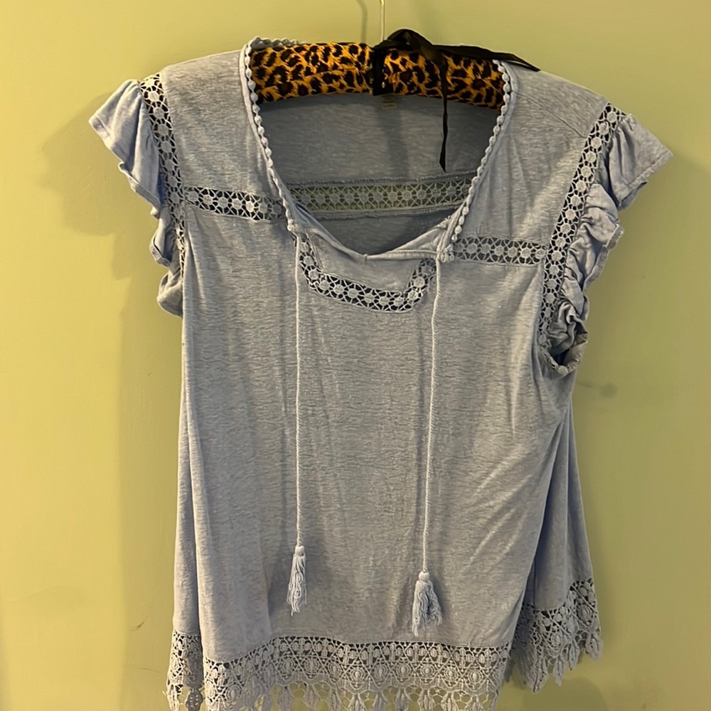 Woman’s blue shirt size large